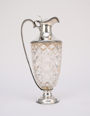 Lot 122 - A George V silver mounted wine ewer