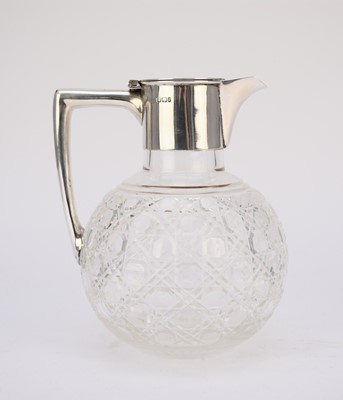 Lot 70 - An Edwardian silver mounted claret jug