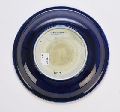 Lot 259 - A William Moorcroft 'Moonlit Blue' plate, circa 1925
