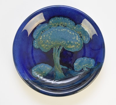 Lot 260 - A William Moorcroft 'Moonlit Blue' landscapee plate, circa 1925