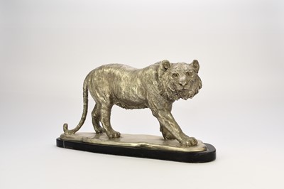 Lot 529 - A white metal plated cast resin figure of a tiger