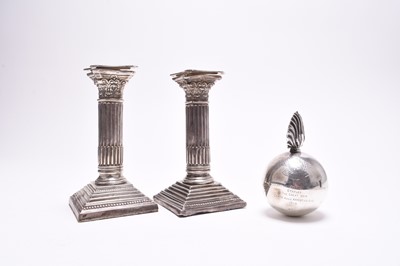 Lot 97 - A novelty silver table lighter in the form of a bomb and two candlesticks