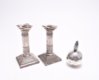Lot 97 - A novelty silver table lighter in the form of a bomb and two candlesticks
