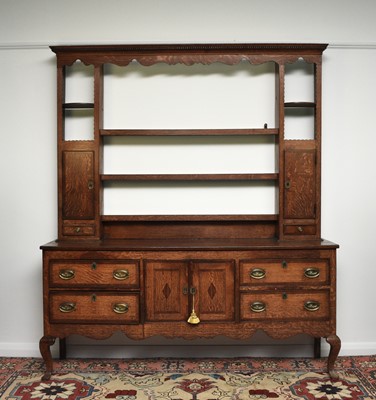 Lot 177 - A George III cross-banded oak dresser and rack, Shropshire