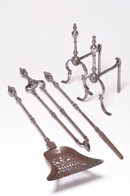 Lot 206 - A set of 19th century polished steel fire tools and fire dogs