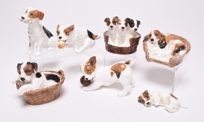 Lot 98 - Seven Royal Doulton 'Dogs of Character' and a willow pattern box