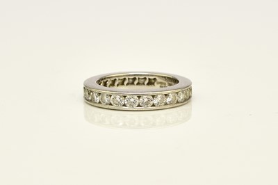 Lot 27 - A De Beers platinum diamond full eternity ring