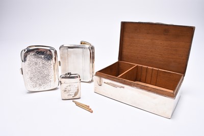 Lot 41 - A silver mounted cigarette box, two silver cigarette cases and a vesta case
