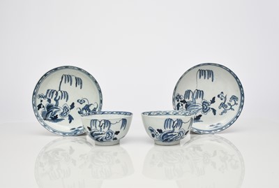 Lot 135 - A pair of uncommon Richard Chaffers 'Fringed Tree Rock' tea bowls and saucers, circa 1760-65