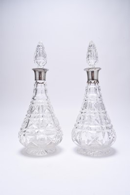 Lot 15 - A matched pair of silver mounted cut glass decanters and six silver spoons