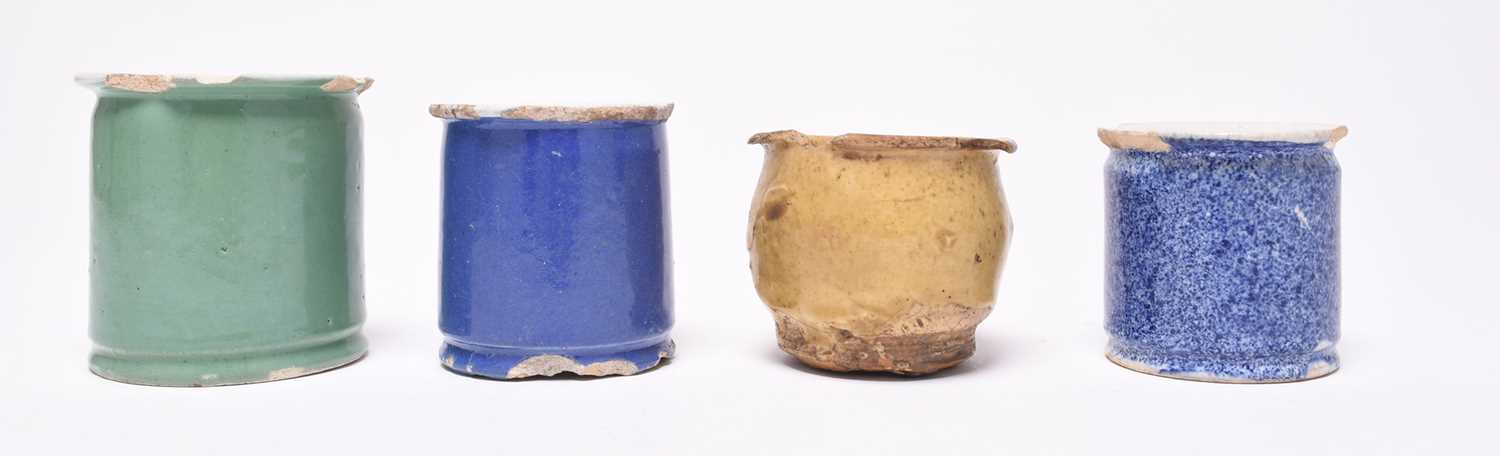 Lot 14 - Four ointment pots