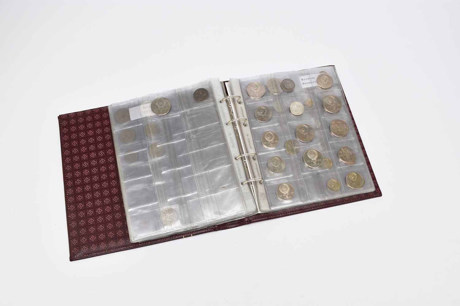Lot 239 - Maroon album containing 135 world coins form Europe and Asia