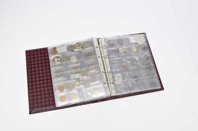 Lot 239 - Maroon album containing 135 world coins form Europe and Asia