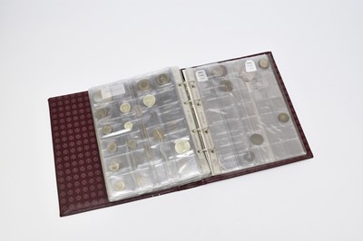 Lot 239 - Maroon album containing 135 world coins form Europe and Asia