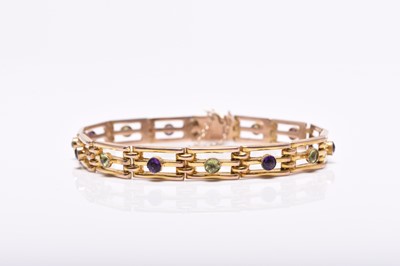 Lot 48 - An early 20th century peridot and amethyst set bracelet