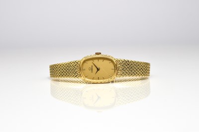 Lot 61 - Omega: A lady's 18ct gold bracelet watch