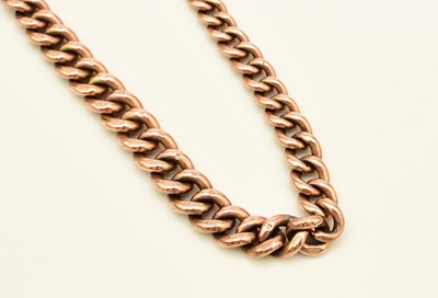 Lot 49 - A 9ct rose gold graduated curb link Albert