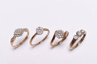 Lot 256 - Four 9ct gold diamond set rings