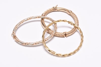 Lot 209 - Three 9ct gold bangles