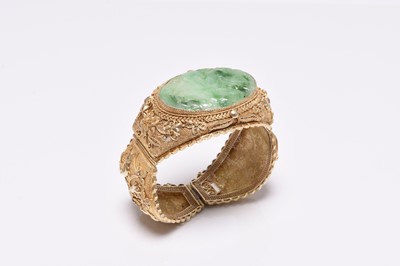 Lot 392 - A jade and gilt metal bangle and a pair of jade earrings