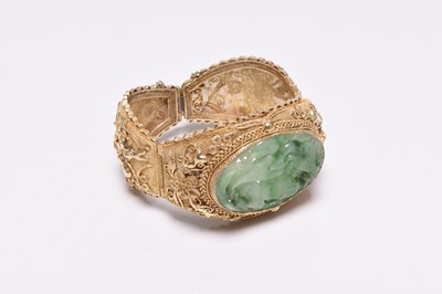 Lot 392 - A jade and gilt metal bangle and a pair of jade earrings