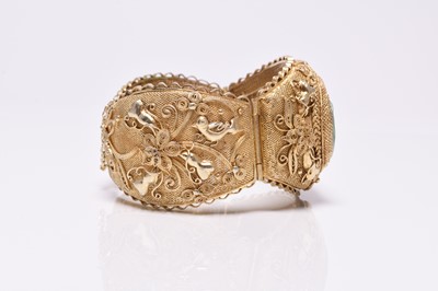 Lot 392 - A jade and gilt metal bangle and a pair of jade earrings