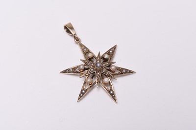 Lot 310 - An early 20th century split seed pearl set star pendant