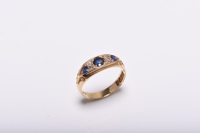 Lot 372 - An Edwardian 18ct gold seven stone diamond and untested sapphire ring