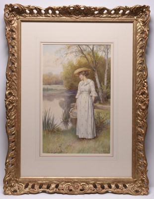 Lot 145 - Charles Edward Wilson (1854-1941) Lady out walking along the riverside