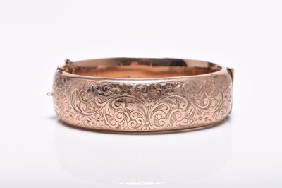 Lot 313 - A George V 9ct rose gold hinged bangle