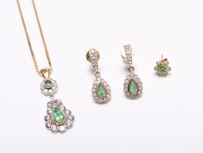 Lot 308 - An emerald and diamond pendant on chain and a pair of earrings