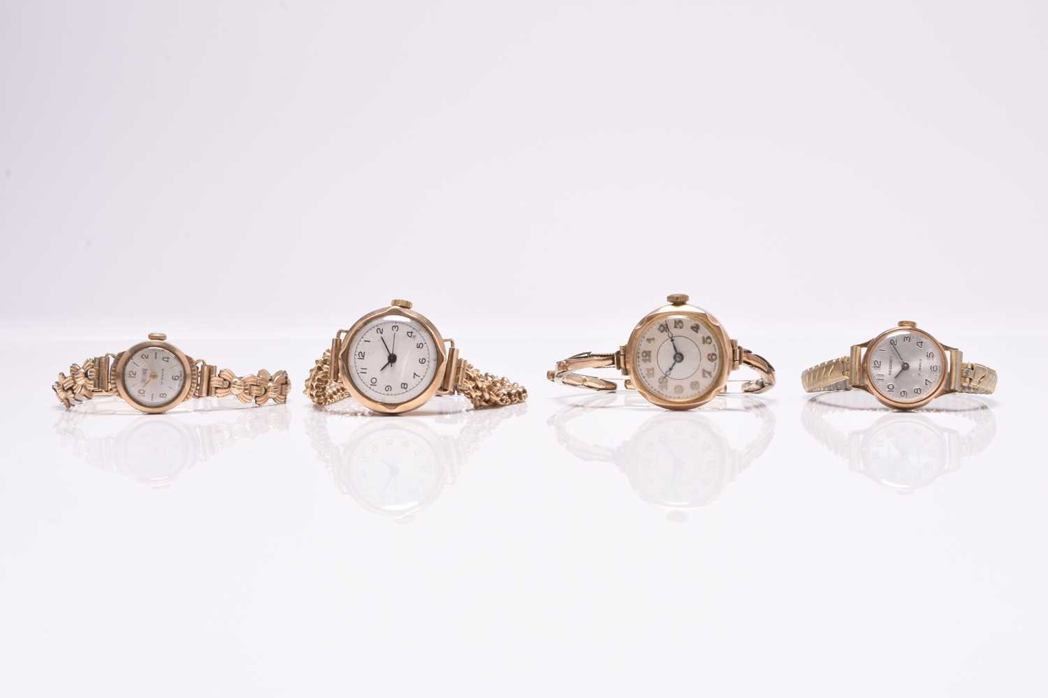 Lot 454 - A group of four lady's 9ct gold bracelet watches