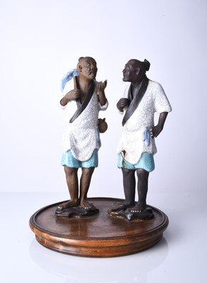 Lot 78 - A Chinese pair of Shiwan 'mud' figures, 20th century