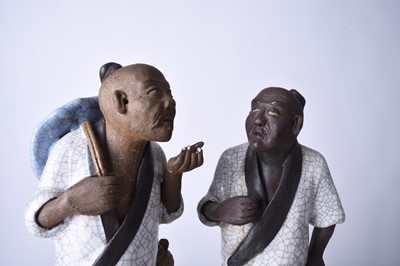 Lot 78 - A Chinese pair of Shiwan 'mud' figures, 20th century