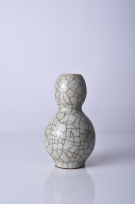 Lot 36 - A Chinese Guan type gourd vase, Qing Dynasty