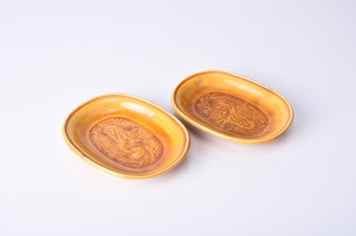 Lot 37 - A pair of Chinese Sancai amber glazed dragon dishes