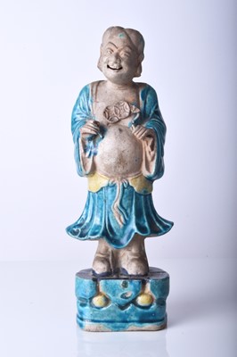 Lot 79 - A Chinese sancai glazed figure of an immortal, Ming Dynasty