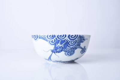 Lot 64 - A Chinese 'Bleu de Hue' blue and white dragon bowl, 18th century