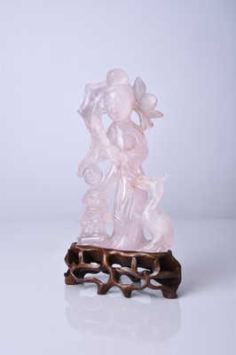 Lot 132 - A Chinese rose quartz figure of Guanyin, Qing Dynasty, 19th century