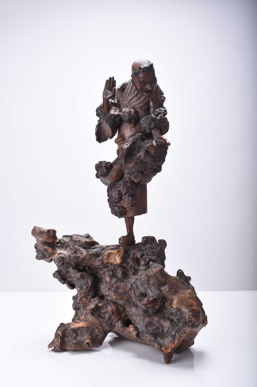 Lot 132 - Three Chinese carved wood figures of Luohan, Qing Dynasty