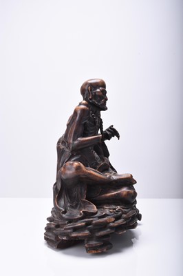 Lot 132 - Three Chinese carved wood figures of Luohan, Qing Dynasty