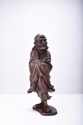 Lot 132 - Three Chinese carved wood figures of Luohan, Qing Dynasty