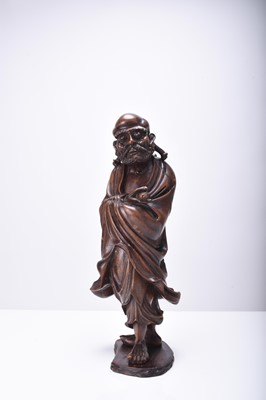 Lot 132 - Three Chinese carved wood figures of Luohan, Qing Dynasty
