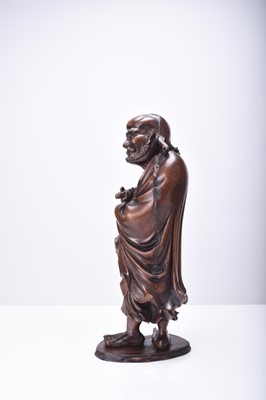 Lot 132 - Three Chinese carved wood figures of Luohan, Qing Dynasty