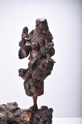 Lot 132 - Three Chinese carved wood figures of Luohan, Qing Dynasty