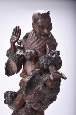 Lot 132 - Three Chinese carved wood figures of Luohan, Qing Dynasty