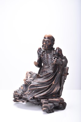 Lot 132 - Three Chinese carved wood figures of Luohan, Qing Dynasty