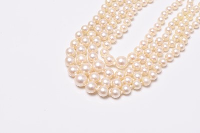 Lot 345 - A four strand graduated cultured pearl necklace with 18ct white gold diamond set clasp