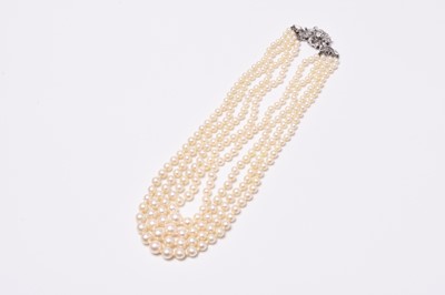 Lot 345 - A four strand graduated cultured pearl necklace with 18ct white gold diamond set clasp