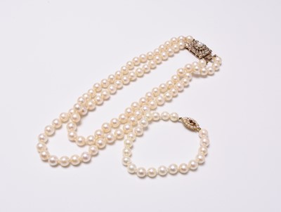 Lot 222 - A two strand cultured pearl necklace and a cultured pearl bracelet